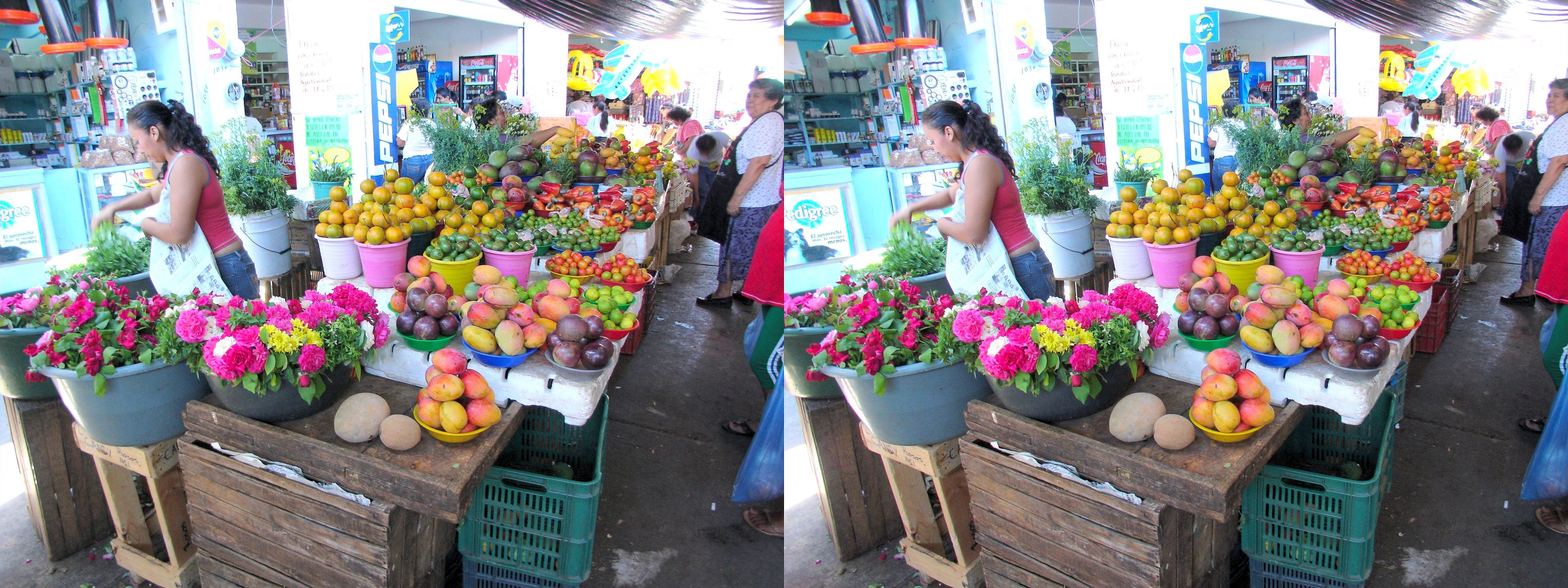 Vendeurs de fruits et légumes au marché.