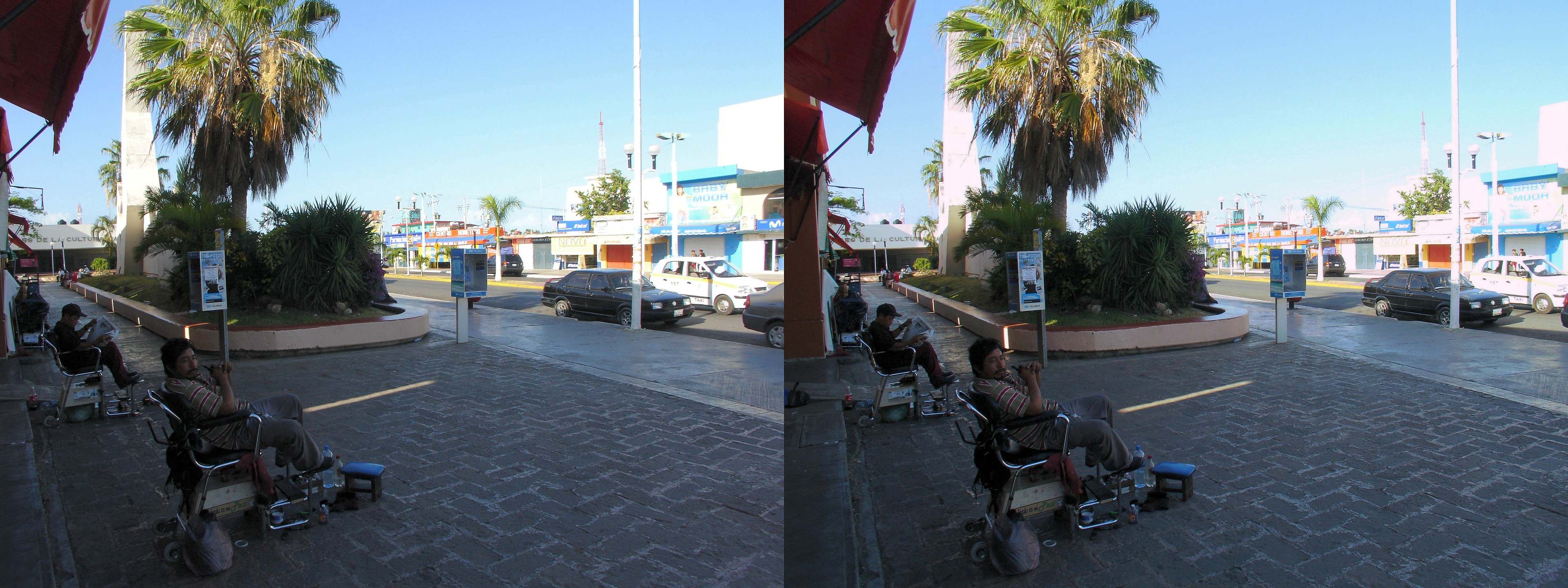 Cireurs de chaussure sur l'Avenida Heroes.
