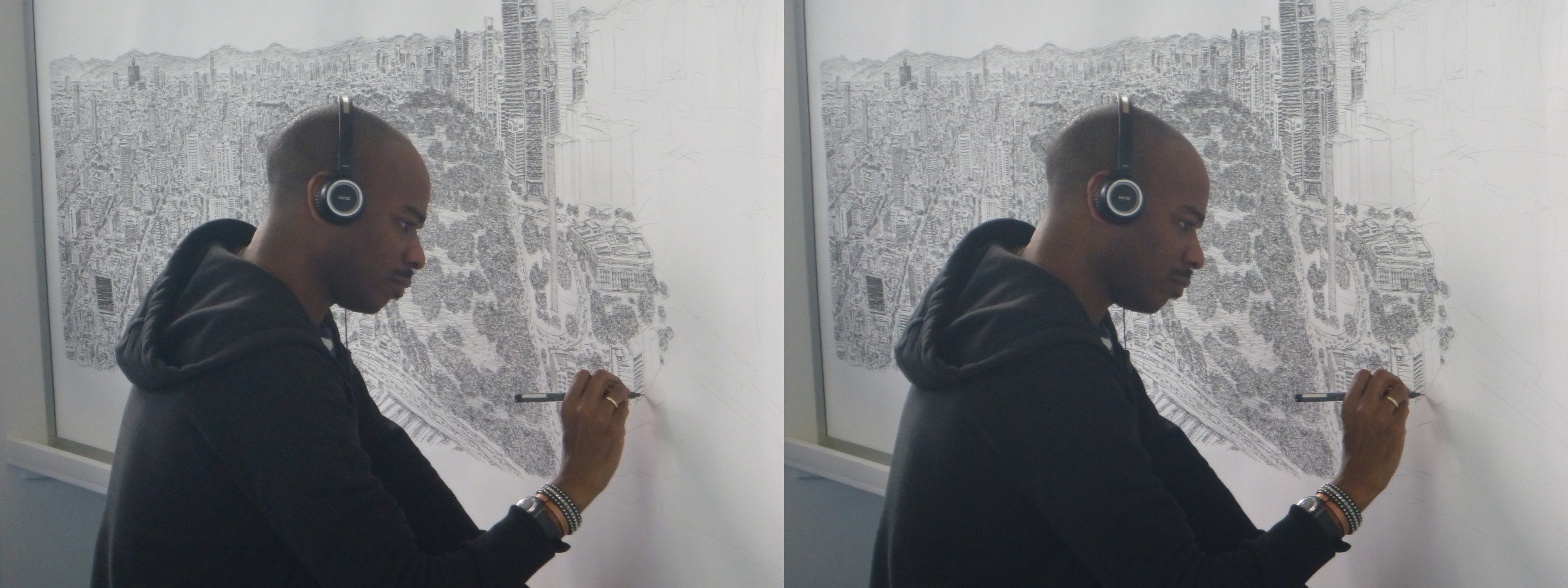 L'artiste britannique Stephen Wiltshire en train de dessiner de mémoire le panorama de la ville de Mexico.