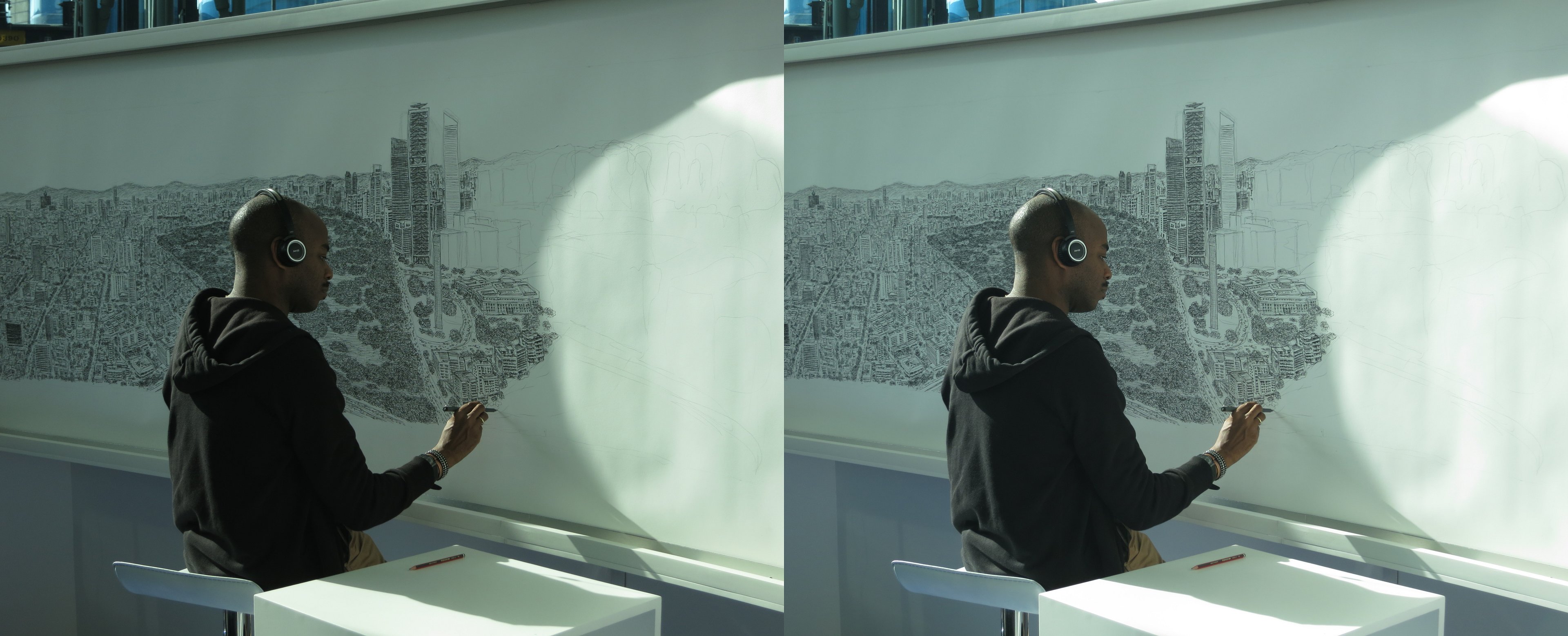 L'artiste britannique Stephen Wiltshire en train de dessiner de mémoire le panorama de la ville de Mexico.